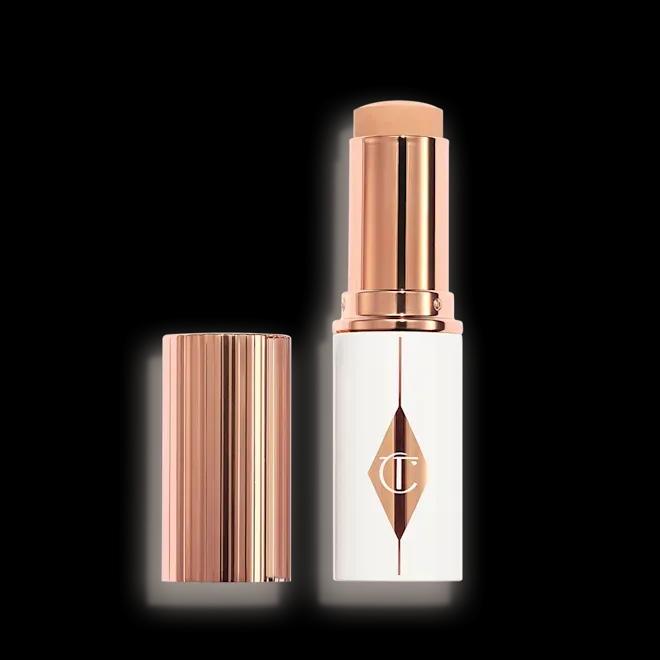 Тональна основа у стіку Charlotte Tilbury Unreal Skin Sheer Glow Tint