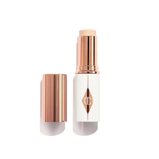 Тональна основа у стіку Charlotte Tilbury Unreal Skin Sheer Glow Tint