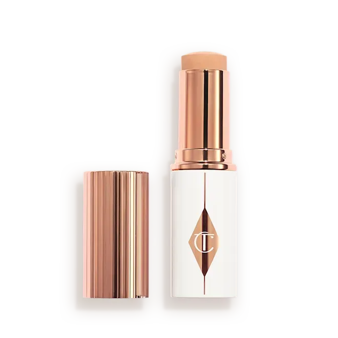 Тональна основа у стіку Charlotte Tilbury Unreal Skin Sheer Glow Tint